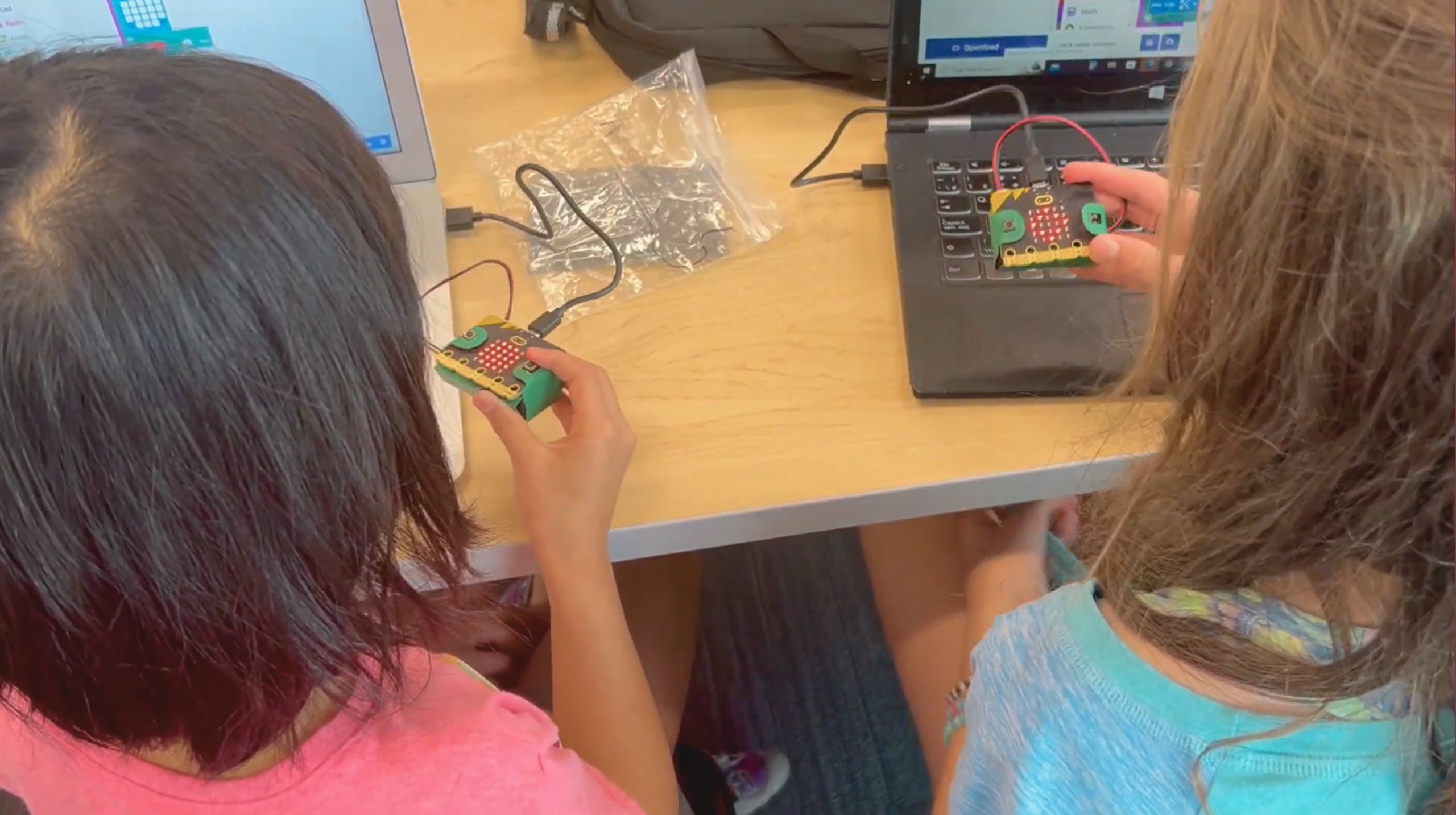 Girls learning to code in a collaborative environment
